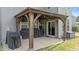 Covered outdoor patio with wood frame, offering ample space for entertaining and grilling at 25 Gallery Park Dr, Franklinton, NC 27525