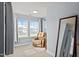 Sitting area with neutral colors and large windows that provide natural light and neighborhood views at 25 Gallery Park Dr, Franklinton, NC 27525
