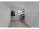Bright and spacious walk-in closet with white wire shelving for ample storage at 25 Gallery Park Dr, Franklinton, NC 27525