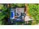 Aerial view of property featuring a pool, patio, and landscaped grounds surrounded by mature trees at 2511 Bexley Ave, Durham, NC 27707