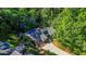 An aerial view shows a home with a pool, green landscaping, and a concrete driveway at 2511 Bexley Ave, Durham, NC 27707