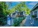 Exterior view of the home showcases in-ground pool, patio, deck, and well-maintained landscape at 2511 Bexley Ave, Durham, NC 27707
