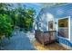 Charming home exterior showcases a deck, stone patio, gravel beds, and garden beds at 2511 Bexley Ave, Durham, NC 27707