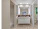 Bathroom features a modern vanity with dual sinks, marble counters and stylish lighting at 2511 Bexley Ave, Durham, NC 27707