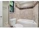 Full bathroom with a tiled shower and a tub, plus marble accents and modern fixtures at 2511 Bexley Ave, Durham, NC 27707