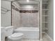 Full bathroom showcases tiled shower/tub, marble accents, and built-in shelving at 2511 Bexley Ave, Durham, NC 27707