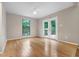 Bedroom with hardwood floors, natural light, and access to a patio at 2511 Bexley Ave, Durham, NC 27707