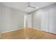 Bedroom featuring hardwood floors, ample closet space, and neutral walls for versatile decor at 2511 Bexley Ave, Durham, NC 27707