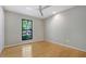 Bright and airy bedroom with hardwood floors, neutral walls, and a large window at 2511 Bexley Ave, Durham, NC 27707