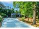 Spacious driveway leading to a beautiful home with mature trees and landscaped surroundings at 2511 Bexley Ave, Durham, NC 27707