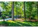 Beautiful home with a long driveway, mature trees, and a well-manicured lawn at 2511 Bexley Ave, Durham, NC 27707