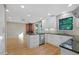 Bright kitchen with granite countertops, stainless appliances, and wood floors at 2511 Bexley Ave, Durham, NC 27707
