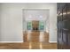 Inviting living room with a brick fireplace and hardwood floors bathed in natural light at 2511 Bexley Ave, Durham, NC 27707