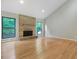 Bright living room with a brick fireplace and large windows at 2511 Bexley Ave, Durham, NC 27707