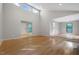 Open-concept living area featuring hardwood floors and high ceilings at 2511 Bexley Ave, Durham, NC 27707