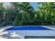 An in-ground pool surrounded by lush greenery at 2511 Bexley Ave, Durham, NC 27707