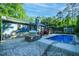 An in-ground pool with an outdoor oven and a stone patio at 2511 Bexley Ave, Durham, NC 27707