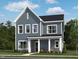 Charming two-story home with gray siding, a cozy porch, and well-maintained landscaping at 261 Marvel Dr # 136, Rolesville, NC 27571