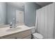 Neat bathroom featuring a modern shower curtain and a vanity area with sink at 281 Derwin Dr, Timberlake, NC 27583