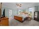 Spacious primary bedroom featuring a ceiling fan, two windows, and ensuite bathroom access at 281 Derwin Dr, Timberlake, NC 27583