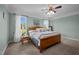 A bright bedroom featuring soft natural light, neutral walls, and plush carpeting at 281 Derwin Dr, Timberlake, NC 27583