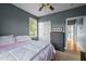 Comfortable bedroom featuring neutral carpet, two windows and stylish dresser at 281 Derwin Dr, Timberlake, NC 27583