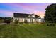 Well maintained single-story home featuring verdant lawn and manicured landscaping at 281 Derwin Dr, Timberlake, NC 27583