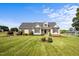 Charming home with a well-manicured front lawn and inviting curb appeal under a clear blue sky at 281 Derwin Dr, Timberlake, NC 27583