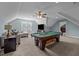 Spacious game room featuring a pool table, comfortable seating, and abundant natural light at 281 Derwin Dr, Timberlake, NC 27583