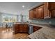 Stylish kitchen with granite countertops, stainless steel appliances and a view to the backyard at 281 Derwin Dr, Timberlake, NC 27583