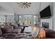 Comfortable living room features hardwood floors, fireplace, large windows and neutral walls at 281 Derwin Dr, Timberlake, NC 27583