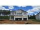 Two-story home featuring a two-car garage and neutral siding, with landscaping potential at 30 Bold Dr, Youngsville, NC 27596
