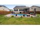 Charming backyard featuring an in-ground pool, patio, and well-maintained lawn at 302 Kinney Glenn Ct, Durham, NC 27713