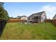 Spacious backyard with a kidney-shaped pool, patio area, lounge chairs, and privacy fence at 302 Kinney Glenn Ct, Durham, NC 27713