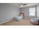 Bedroom with ceiling fan, natural light, and full sized bed at 302 Kinney Glenn Ct, Durham, NC 27713