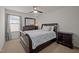 Bedroom with a window letting in natural light, ceiling fan, and full sized bed at 302 Kinney Glenn Ct, Durham, NC 27713