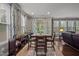 Bright dining area with large windows, hardwood floors, and views of the backyard at 302 Kinney Glenn Ct, Durham, NC 27713