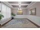Bright dining room with coffered ceilings, wainscoting, and hardwood floors at 302 Kinney Glenn Ct, Durham, NC 27713