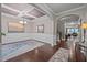 Stylish dining room featuring elegant wainscoting, a coffered ceiling and hardwood floors at 302 Kinney Glenn Ct, Durham, NC 27713