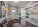 Elegant foyer with hardwood floors, decorative lighting, and a coffered ceiling at 302 Kinney Glenn Ct, Durham, NC 27713
