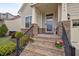 Close-up of the front steps leading to the entrance with stone accents and a welcoming sign at 302 Kinney Glenn Ct, Durham, NC 27713