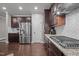Well-equipped kitchen with stainless steel appliances, tiled backsplash, and ample counter space at 302 Kinney Glenn Ct, Durham, NC 27713
