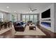 Inviting living room features a brick fireplace, hardwood floors, and lots of natural light at 302 Kinney Glenn Ct, Durham, NC 27713