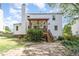 Spacious backyard featuring a covered deck, lush greenery, and a well-maintained lawn at 311 Pate St, Apex, NC 27502