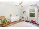 Cozy Bedroom with crib, dresser, and rocking chair, perfect for a new Gathering at 311 Pate St, Apex, NC 27502