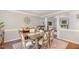 Charming dining room with a rustic wooden table, comfortable seating, and decorative accents at 311 Pate St, Apex, NC 27502
