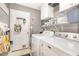 Efficient laundry room with modern appliances, storage cabinets, and convenient access to the exterior at 311 Pate St, Apex, NC 27502