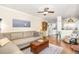 Cozy living room featuring hardwood floors, comfortable seating, and an open layout at 311 Pate St, Apex, NC 27502