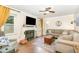 Comfortable living room with a fireplace, large windows, and hardwood flooring at 311 Pate St, Apex, NC 27502