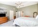 Spacious main bedroom with a ceiling fan, walk-in closets, and access to an ensuite bathroom at 311 Pate St, Apex, NC 27502